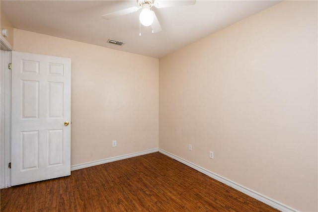 unfurnished room featuring visible vents, wood finished floors, baseboards, and ceiling fan