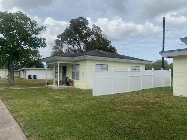 exterior space featuring a yard and fence
