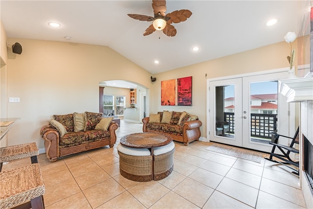 living room with french doors, lofted ceiling, light tile patterned floors, and ceiling fan