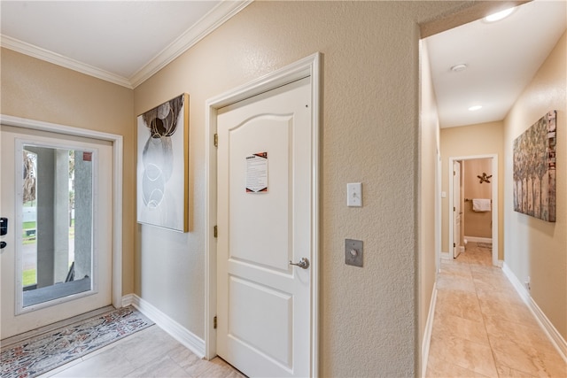 tiled foyer with ornamental molding