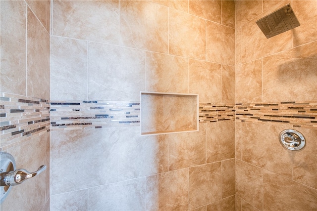 interior space featuring tiled shower