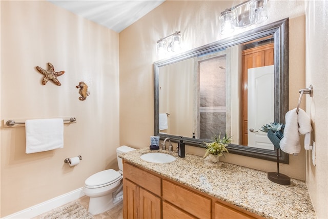 bathroom with vanity, tile patterned floors, and toilet