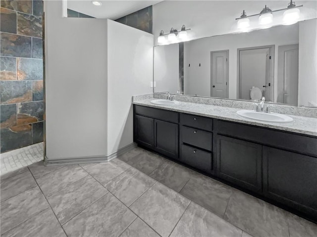 bathroom with a shower and vanity