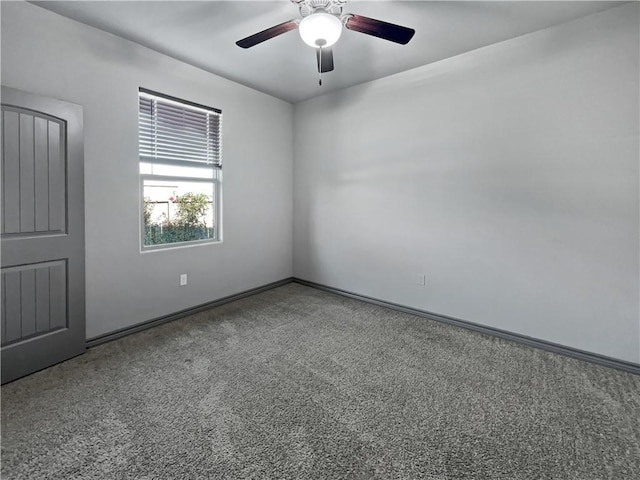 spare room with carpet and ceiling fan