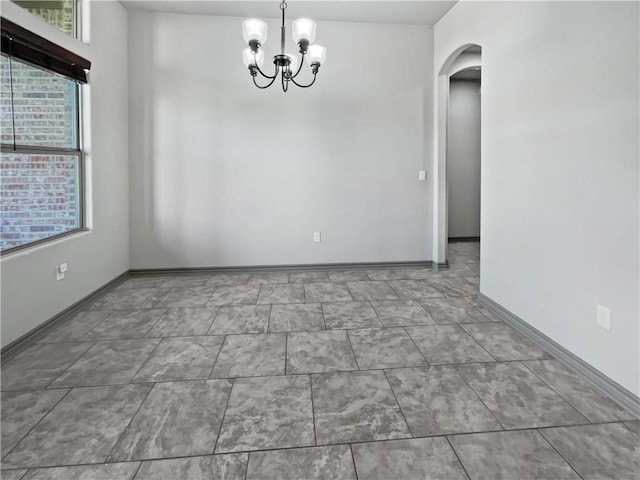 2105 Aquila St, Corpus Christi, TX 78414 - unfurnished room with arched walkways and a chandelier