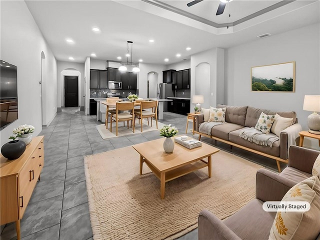 2105 Aquila St, Corpus Christi, TX 78414 - living room featuring arched walkways, a ceiling fan, and recessed lighting