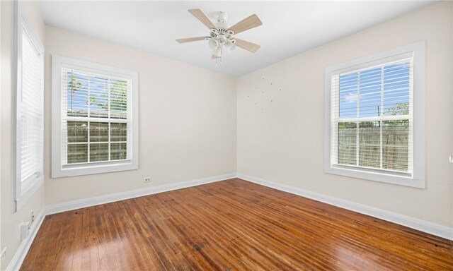 unfurnished room featuring hardwood / wood-style floors and ceiling fan