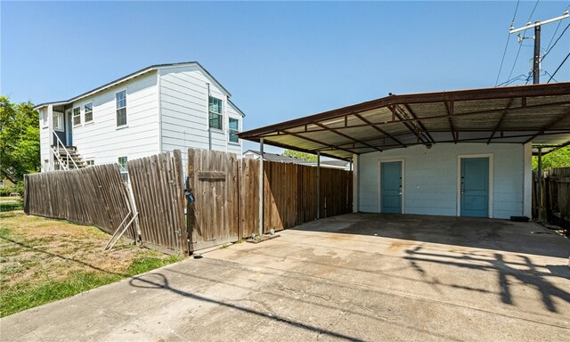 exterior space with a carport