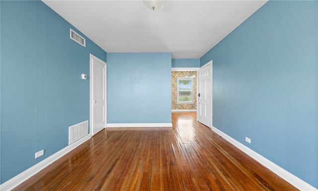 empty room featuring hardwood / wood-style floors