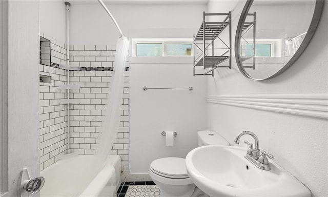 full bathroom with shower / bath combo, tile patterned floors, sink, and toilet