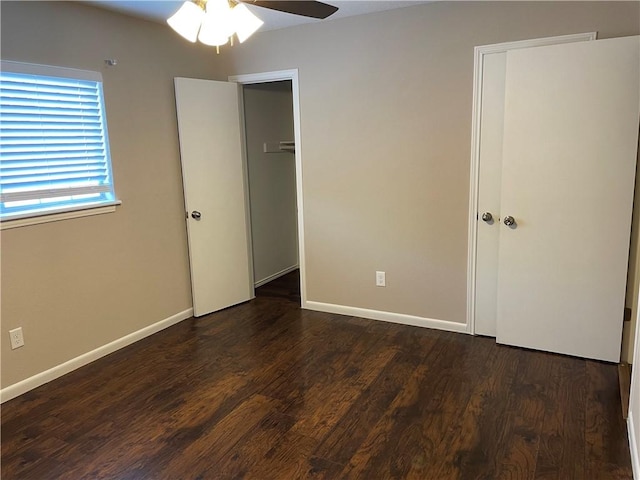 7029 Tamarron Ct, Corpus Christi, TX 78413 - unfurnished bedroom featuring wood finished floors, baseboards, and ceiling fan
