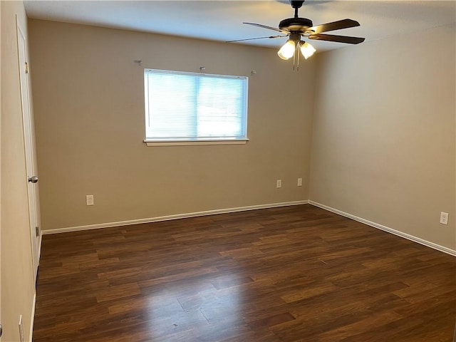 7029 Tamarron Ct, Corpus Christi, TX 78413 - spare room featuring dark wood-style floors, a ceiling fan, and baseboards