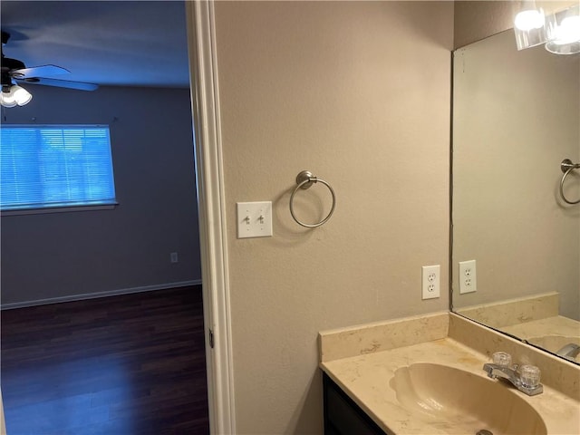 7029 Tamarron Ct, Corpus Christi, TX 78413 - bathroom featuring vanity, a ceiling fan, and wood finished floors