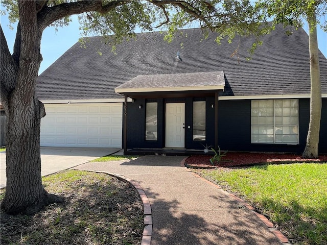7029 Tamarron Ct, Corpus Christi, TX 78413 - view of front of house featuring a shingled roof, driveway, and an attached garage