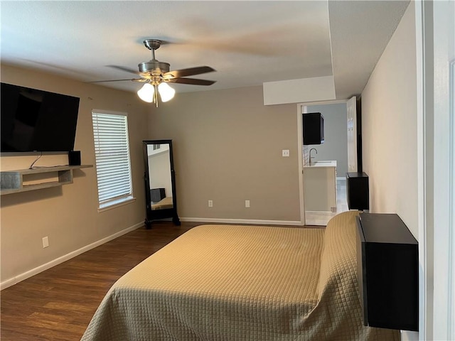 7029 Tamarron Ct, Corpus Christi, TX 78413 - bedroom with dark wood-style floors, baseboards, a sink, and a ceiling fan