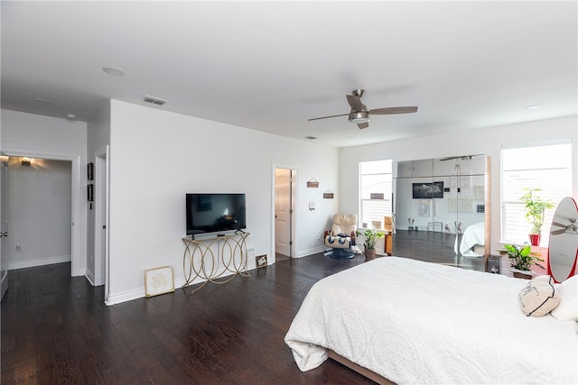 bedroom with dark wood-type flooring and ceiling fan