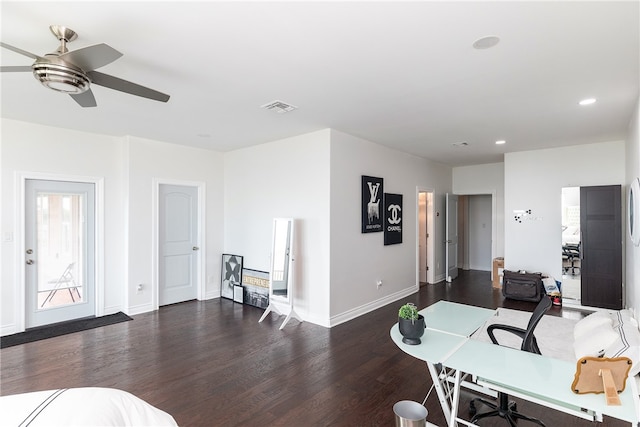 office area with dark wood-type flooring and ceiling fan