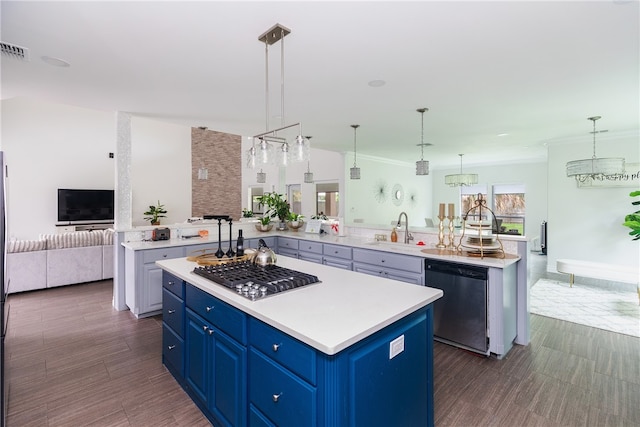 kitchen featuring blue cabinets, sink, a kitchen island, pendant lighting, and appliances with stainless steel finishes