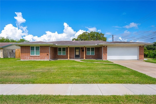 ranch-style house featuring a front lawn and a garage