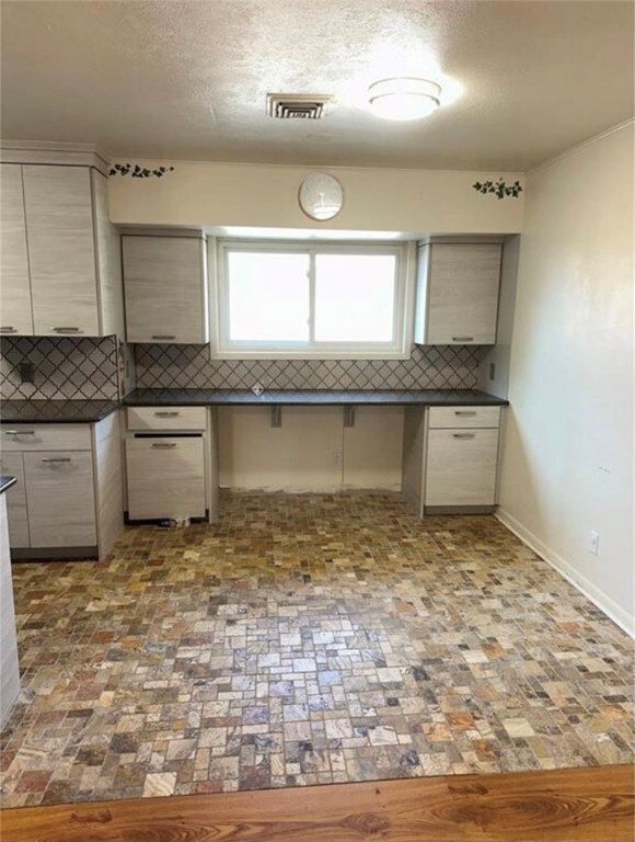 kitchen featuring tasteful backsplash