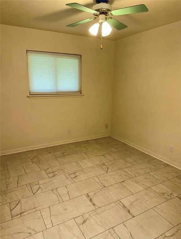 empty room featuring ceiling fan