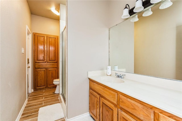 7601 Dijon Lake Dr, Corpus Christi, TX 78413 - bathroom with vanity, a shower stall, and wood finished floors