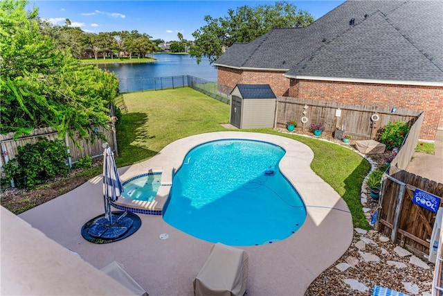 7601 Dijon Lake Dr, Corpus Christi, TX 78413 - view of pool with a storage unit, a pool with connected hot tub, a fenced backyard, a water view, and a patio