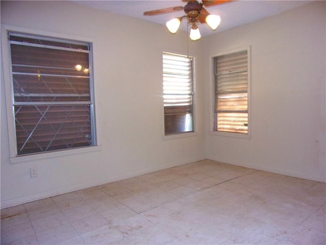 spare room featuring ceiling fan