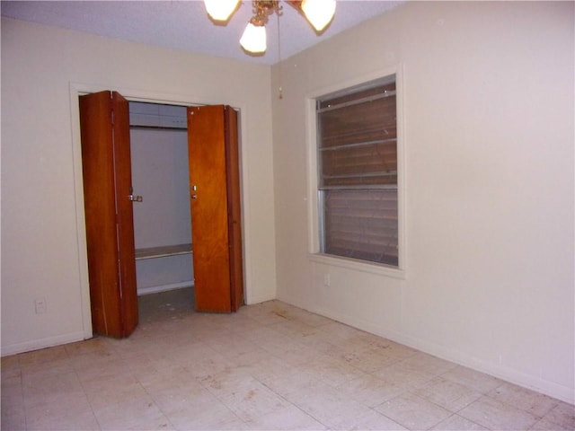 unfurnished room featuring ceiling fan