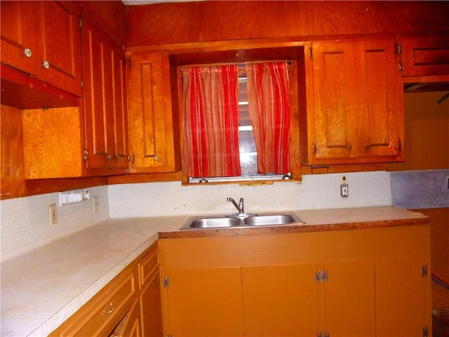 kitchen featuring decorative backsplash and sink