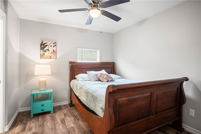 bedroom with hardwood / wood-style flooring and ceiling fan