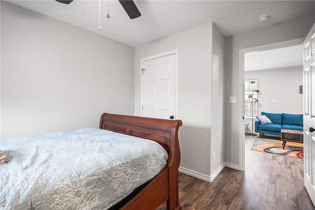 bedroom featuring dark hardwood / wood-style floors and ceiling fan