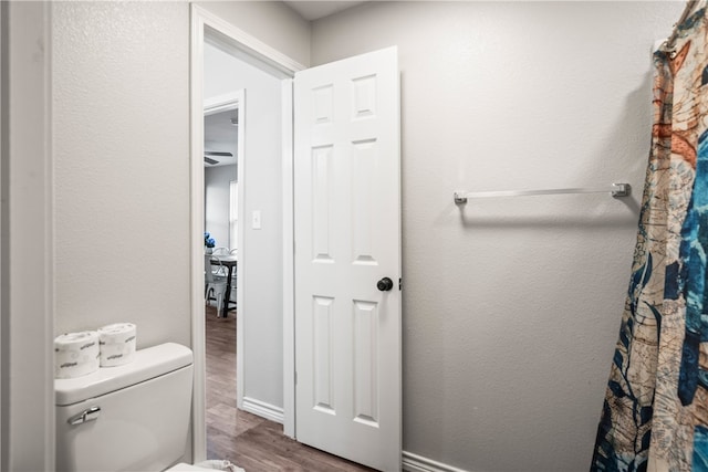 bathroom featuring toilet and hardwood / wood-style flooring