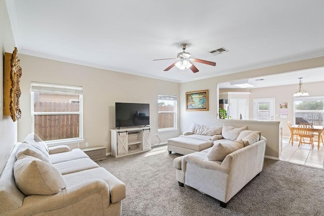 7558 Angelwing Dr, Corpus Christi, TX 78414 - carpeted living area with baseboards, ceiling fan, ornamental molding, and visible vents