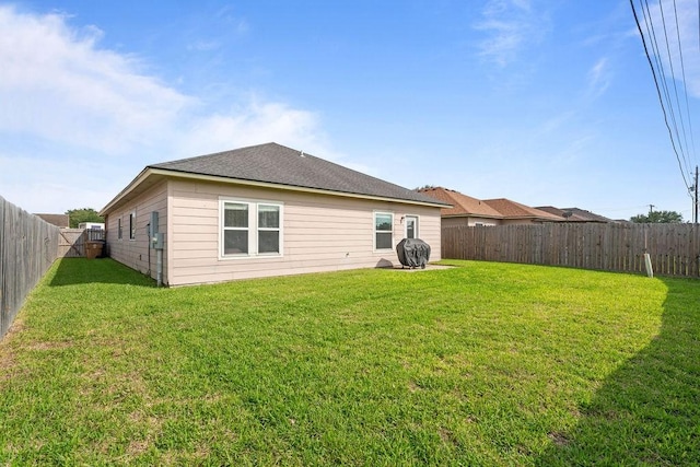 7558 Angelwing Dr, Corpus Christi, TX 78414 - back of house with a lawn and a fenced backyard