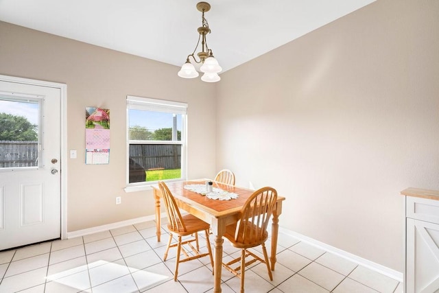 7558 Angelwing Dr, Corpus Christi, TX 78414 - dining area featuring baseboards, a chandelier, and light tile patterned floors