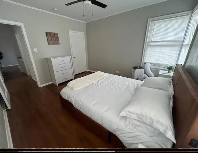 bedroom with ceiling fan and dark hardwood / wood-style flooring