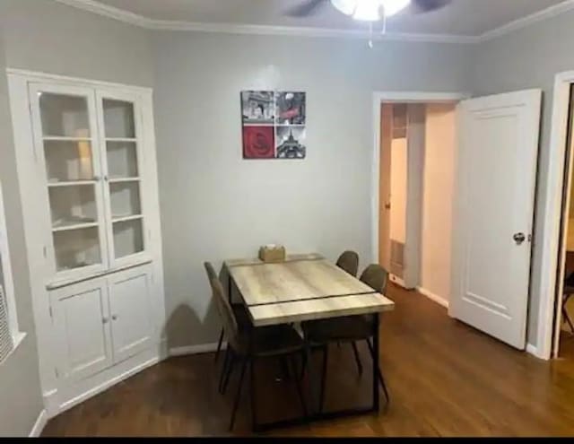 dining room featuring ceiling fan, dark hardwood / wood-style flooring, and ornamental molding