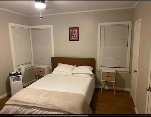 bedroom with ornamental molding