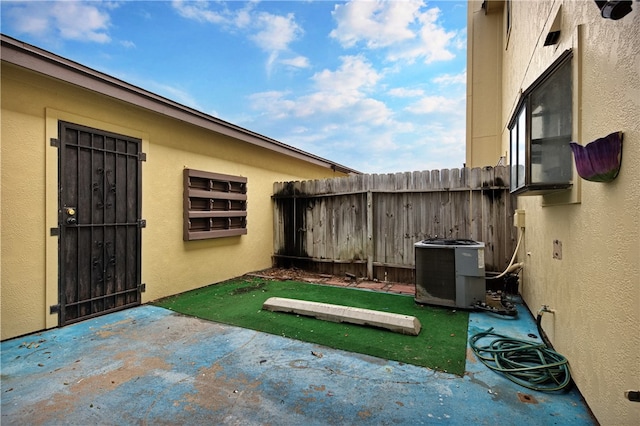 view of yard featuring a patio area and central air condition unit