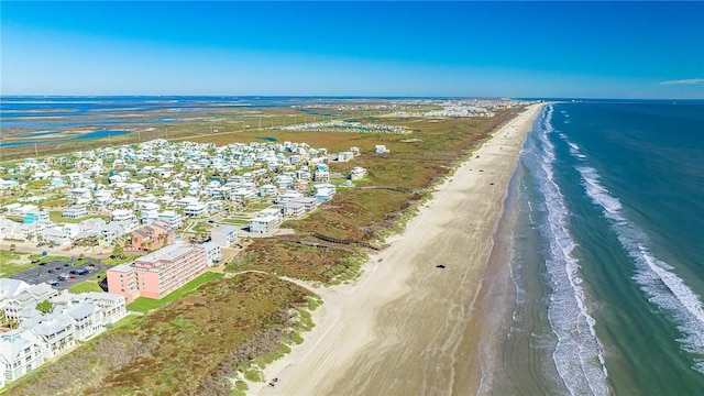 bird's eye view featuring a water view and a view of the beach