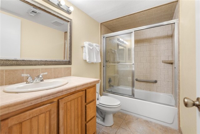 bathroom featuring enclosed tub / shower combo, tile patterned flooring, visible vents, and toilet