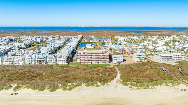 drone / aerial view featuring a water view and a residential view