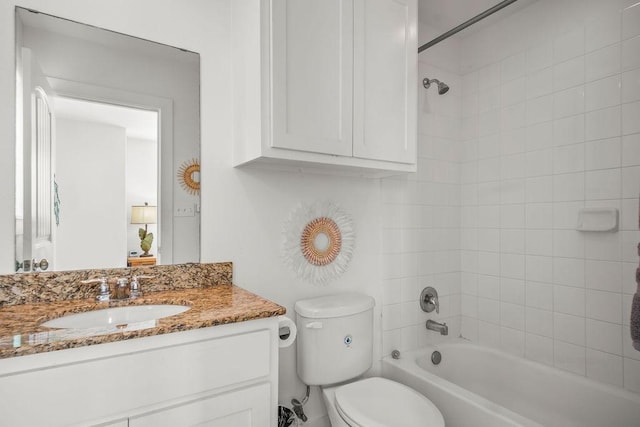 bathroom with vanity, toilet, and shower / bath combination