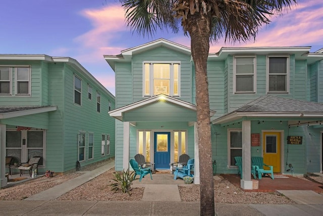 back of property featuring a porch