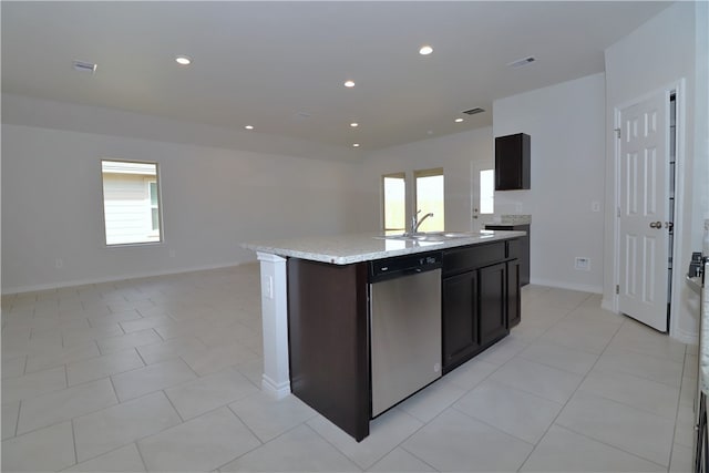 kitchen with dishwasher, a wealth of natural light, a kitchen island with sink, and sink