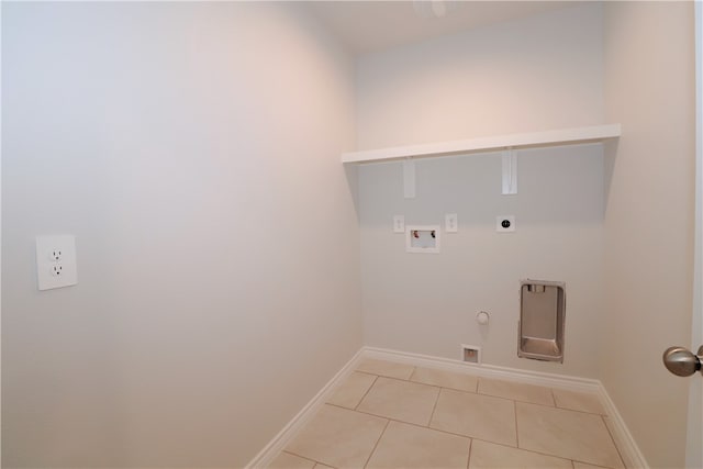 clothes washing area with hookup for an electric dryer, hookup for a washing machine, gas dryer hookup, and light tile patterned floors