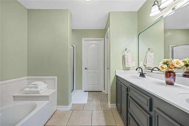 3137 Masterson Dr, Corpus Christi, TX 78415 - bathroom featuring a garden tub, double vanity, tile patterned floors, and a shower stall