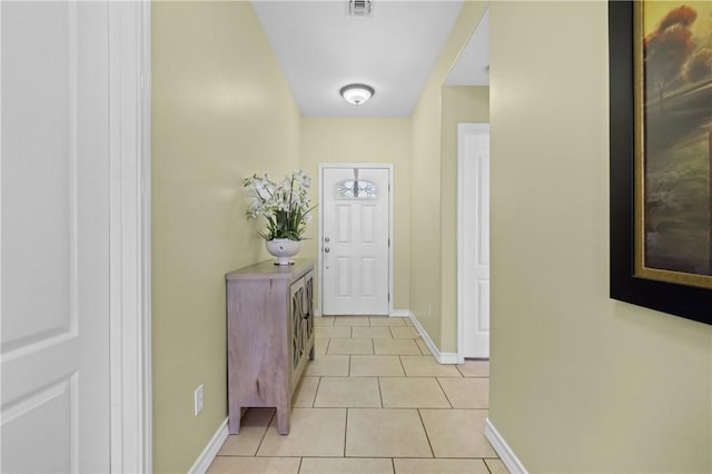 3137 Masterson Dr, Corpus Christi, TX 78415 - doorway to outside featuring light tile patterned floors and baseboards
