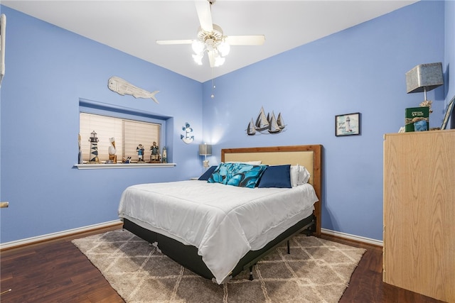 bedroom featuring ceiling fan and dark hardwood / wood-style flooring